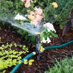 Melnor sprinklers in use watering flower bed to protect blooms