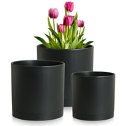 Meowell front view of three black cylinder pots showcasing modern styling and balance