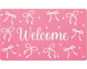 Mindsoft front view of pink bow door mat showing welcome design and durability