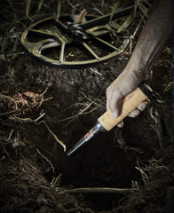 MINELAB PRO-FIND 35 held in hand demonstrating compact size and ergonomic grip benefit