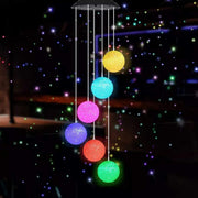 MorTime front view showing crystal ball and spiral mobile illuminating patio