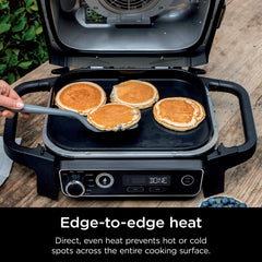Ninja griddle cooking pancakes and bacon showing versatile breakfast searing