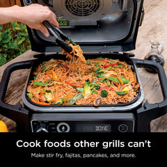 Ninja griddle installed in Woodfire OG700 grill demonstrating secure click-in fit