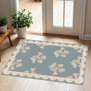 Othilic front view blue scalloped door mat shows welcoming entry benefit