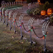 Outus front view of boxed skeleton hand stakes kit showing contents and benefit of ready set