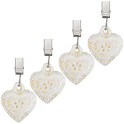 OwnMy front view heart clip showing decorative weight and firm hold