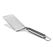 OXO Good Grips turner front view showing wide stainless steel head and balanced weight