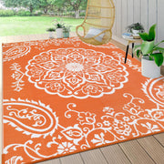 Pauwer front view of boho orange 6x9 rug showing overall design and benefit durable outdoor style