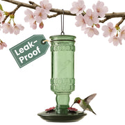 Perky-Pet front view showing antique green bottle and polished base for decorative appeal