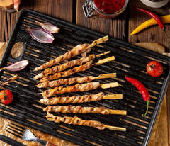 Pinchitto's skewers beside a ruler showing the 10-inch length benefit