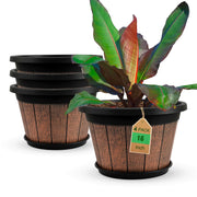 Quarut front view of four whiskey barrel planters showing rustic appeal and curbside staging benefit