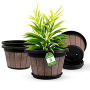 Quarut front view of four whiskey barrel planters showing vintage style and packaging benefit