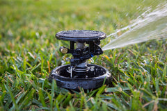 Rain Bird AG-5 brass PJ spray arm close-up, reduces side splash onto walkways