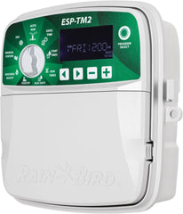 Rain Bird TM2-6 front panel showing dial and buttons for quick programming and ease