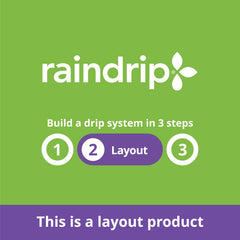 Hand holding Raindrip tubing to show scale and flexible routing benefit