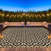 SAND MINE front view of rug with LEDs lighting patio, enhances evening ambiance