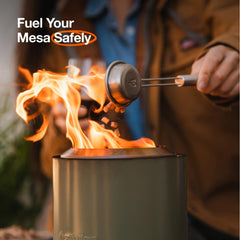 Solo Stove pellet scoop placing pellets into Mesa for safer, controlled fuel loading
