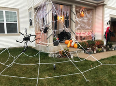 Supoice hung on porch railing to create a spooky entrance