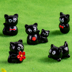 Teenzee cats staged in a fairy garden adding whimsical miniature charm