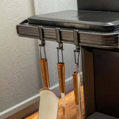 Traeger hooks holding spatula and tongs for fast access while grilling