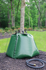 treegator next to garden hose for scale showing compact, high-capacity design
