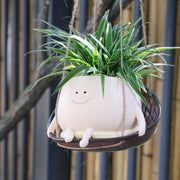 UMESONG front view of hanging smiley-face planter showing decorative charm