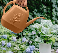 VKPLITE in-use watering can pouring water gently into a potted plant