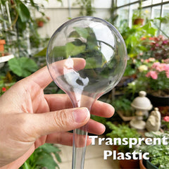 Wellinc globe inserted in a large pot keeping soil evenly moist