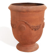 Worth front view of urn planter showing cement texture and rust-like finish