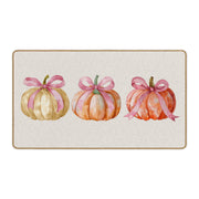WTOGQ front view of pink bow pumpkin mat adding seasonal charm