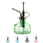 XXXFLOWER front view of green glass mister showing vintage design and decorative appeal