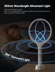 YISSVIC racket positioned on base, demonstrating hands-free auto-zap convenience