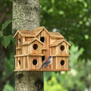 YYYUAN cedar birdhouse front view showing 10 entrances and rustic look