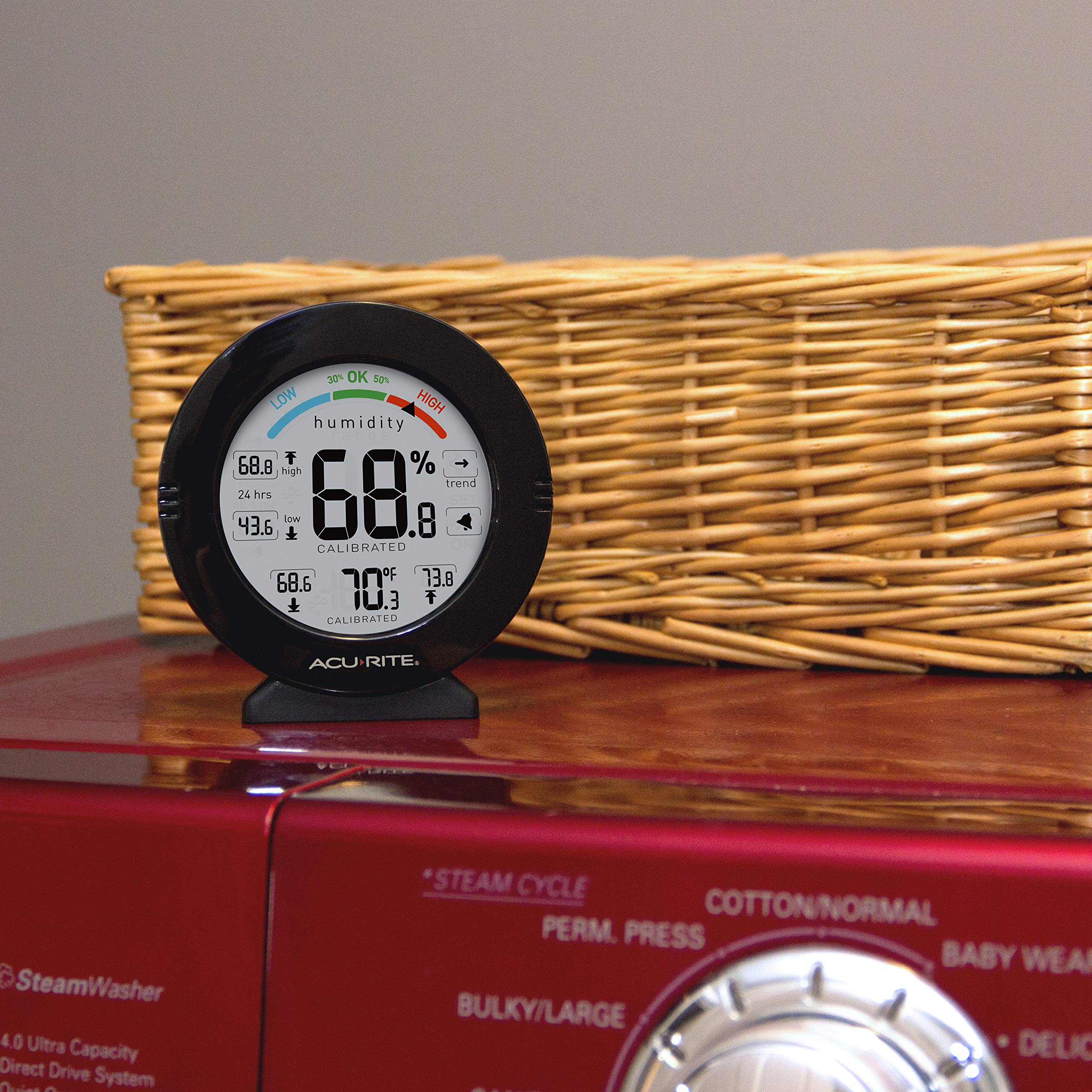 AcuRite next to a ruler showing compact size and easy placement advantage