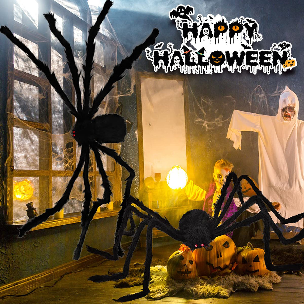 Aiduy spider beside person to show 6.5 ft scale and impressive size