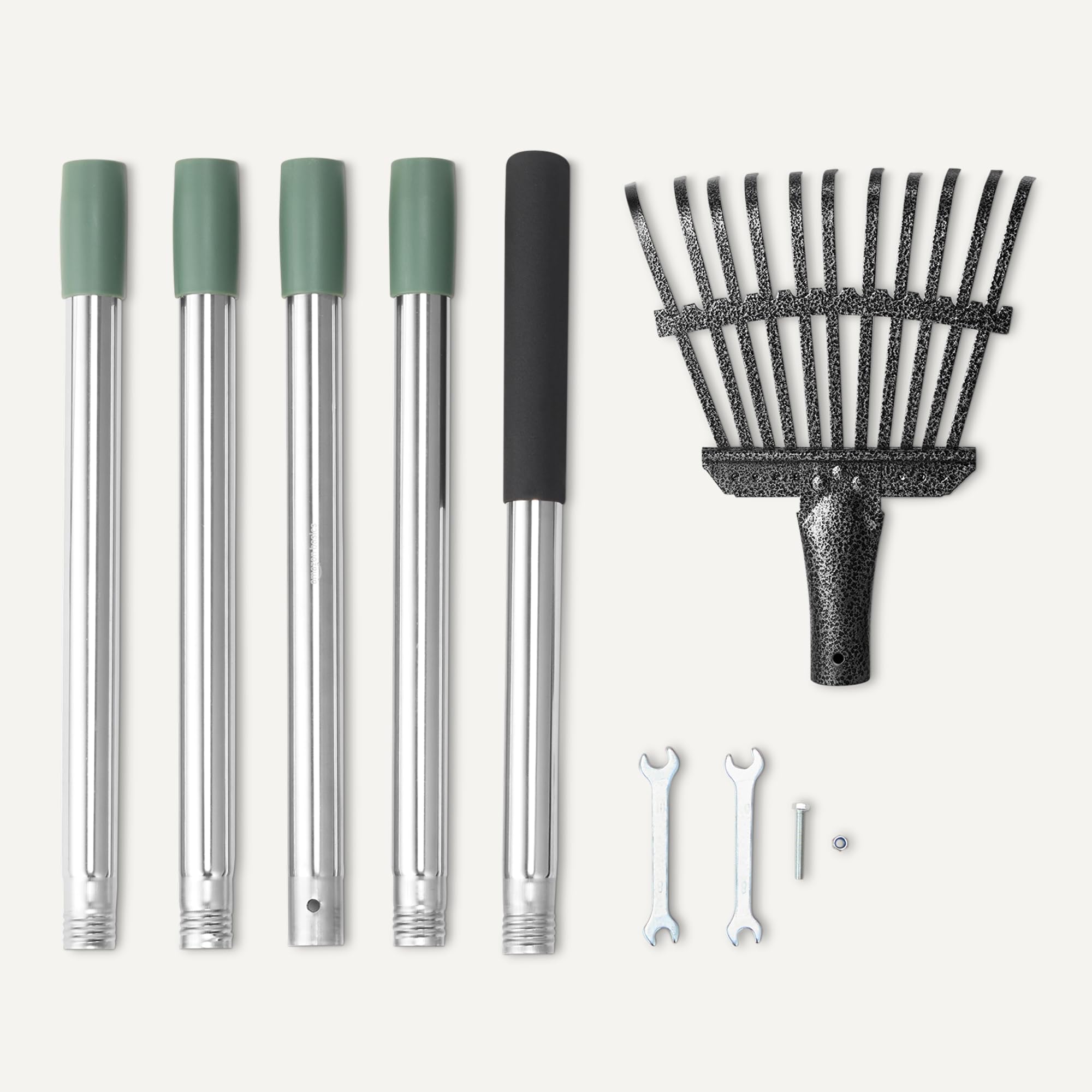 Amazon Basics rake in garden use clearing leaves near shrubs for neat landscaping