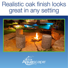 Aquascape stump beside pond hiding pump for neat equipment concealment and tidy edges