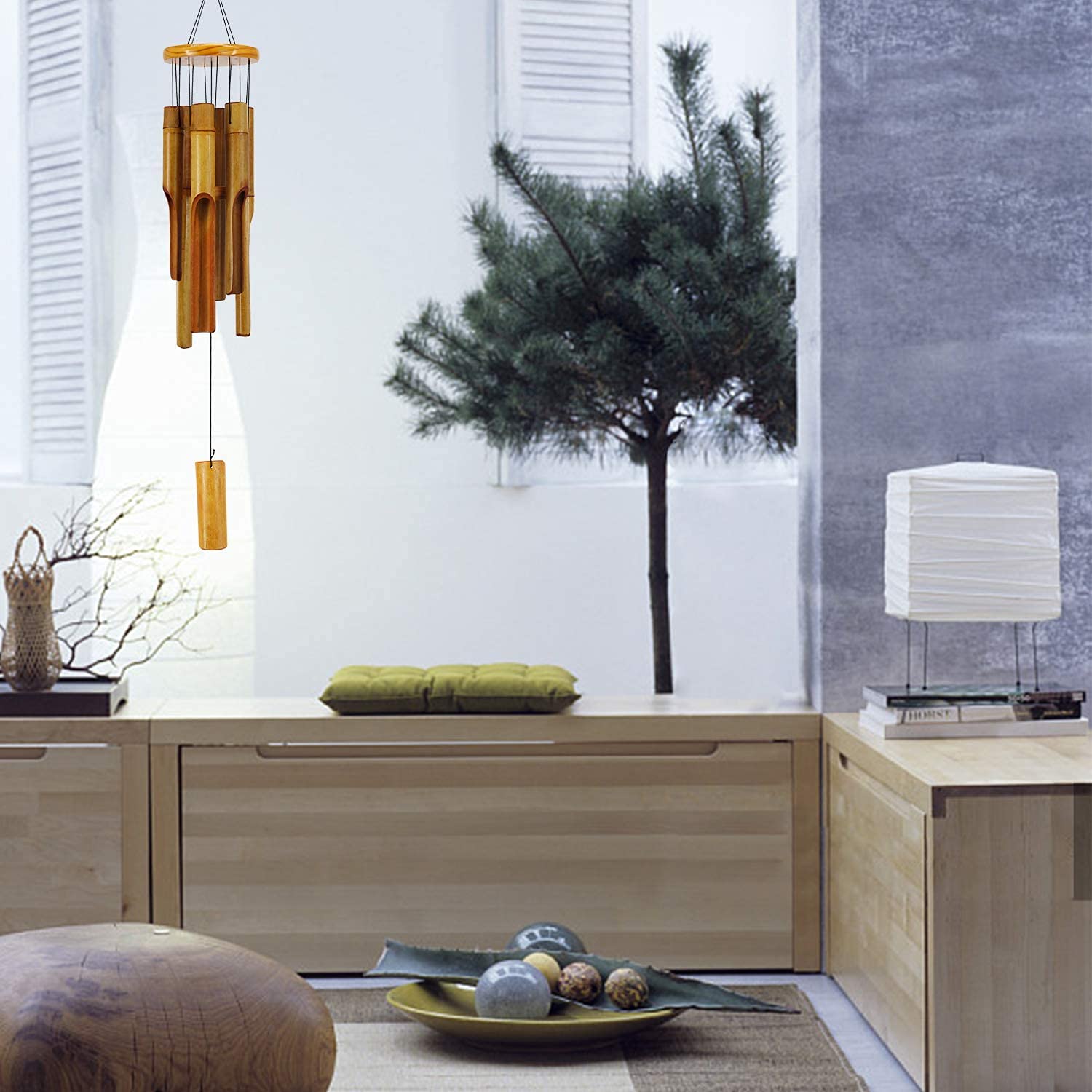 ASTARIN wind chimes in a garden setting adding natural atmosphere and tranquility
