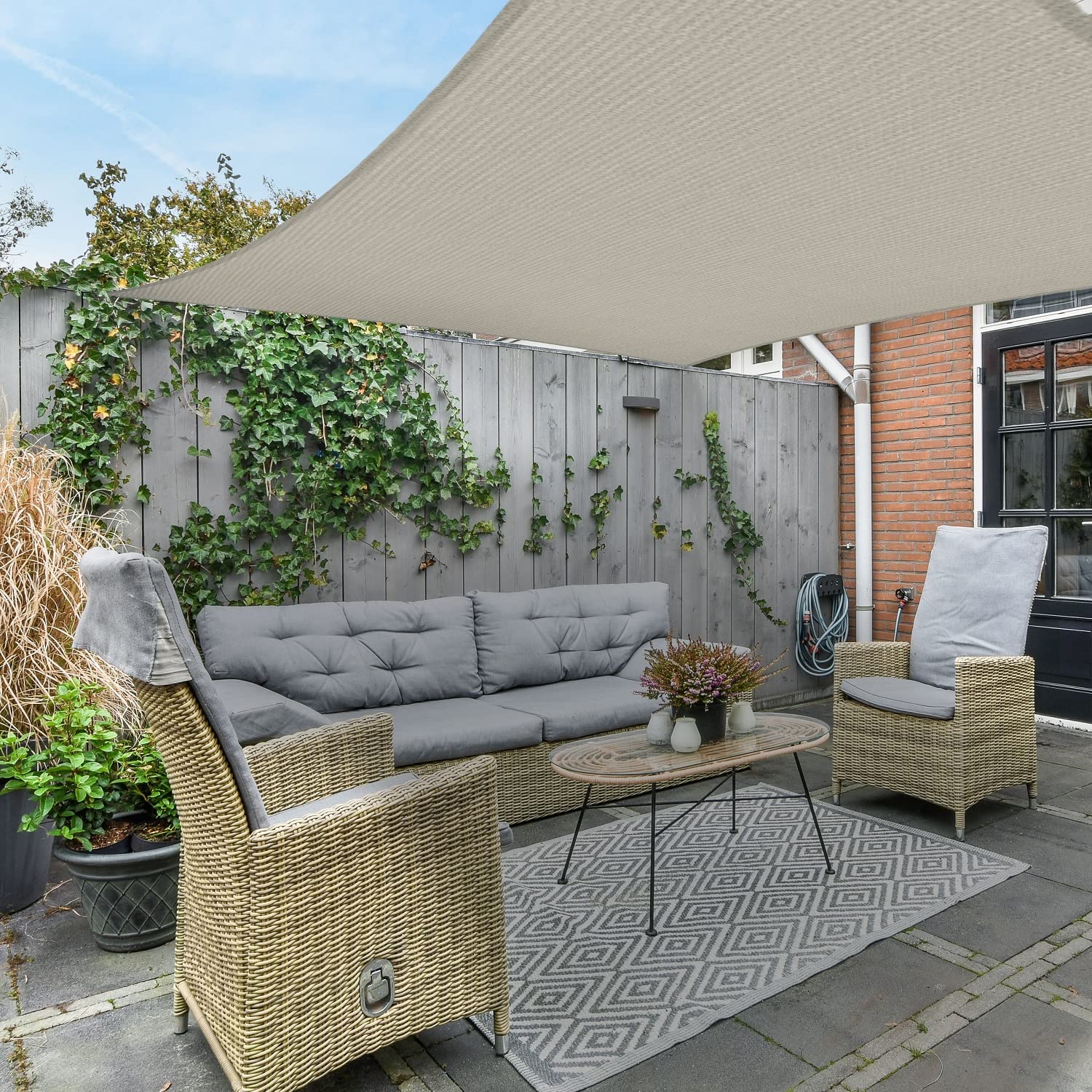 AsterOutdoor poolside lifestyle shot demonstrating comfortable shaded relaxation