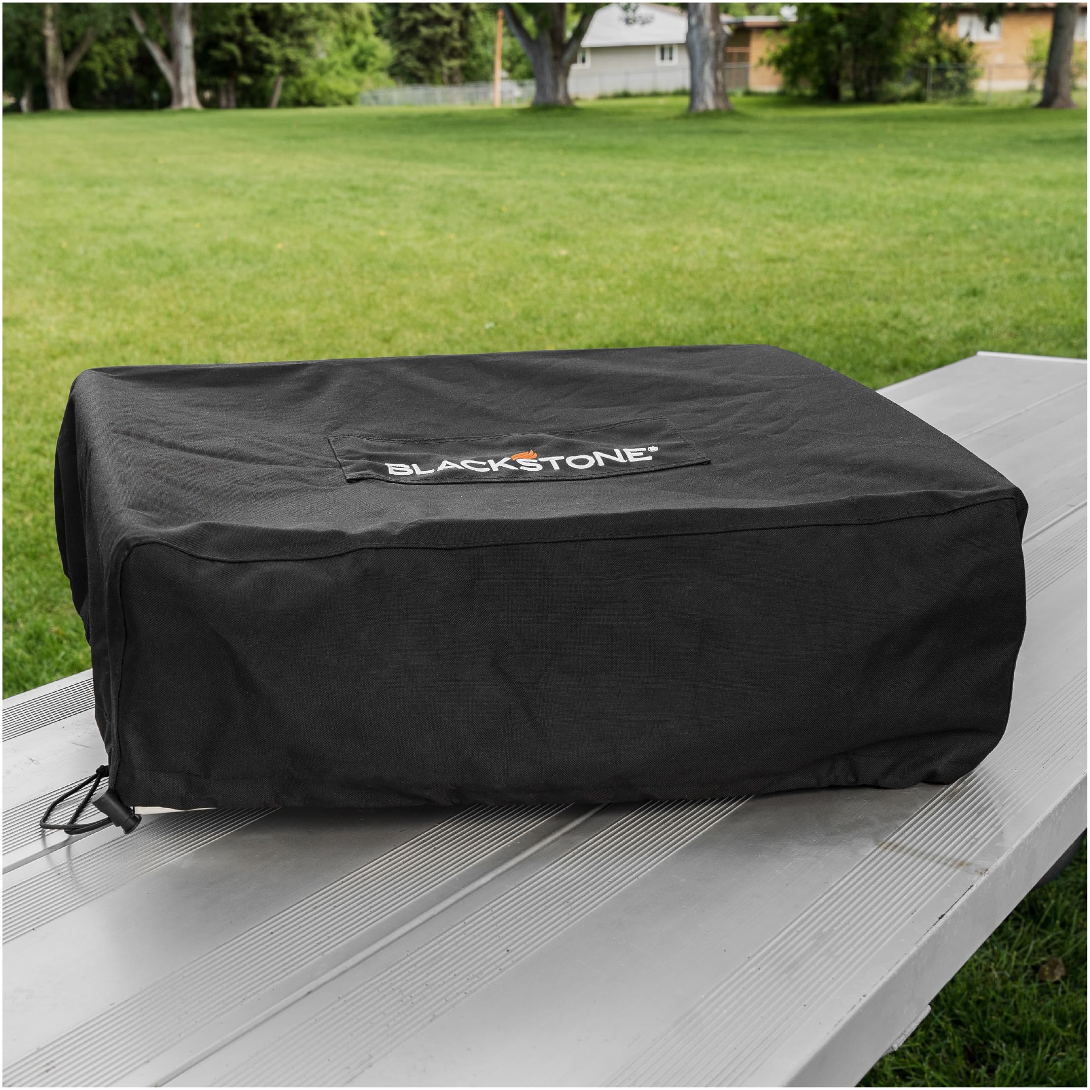 BLACKSTONE covered griddle in backyard lifestyle scene protecting from elements