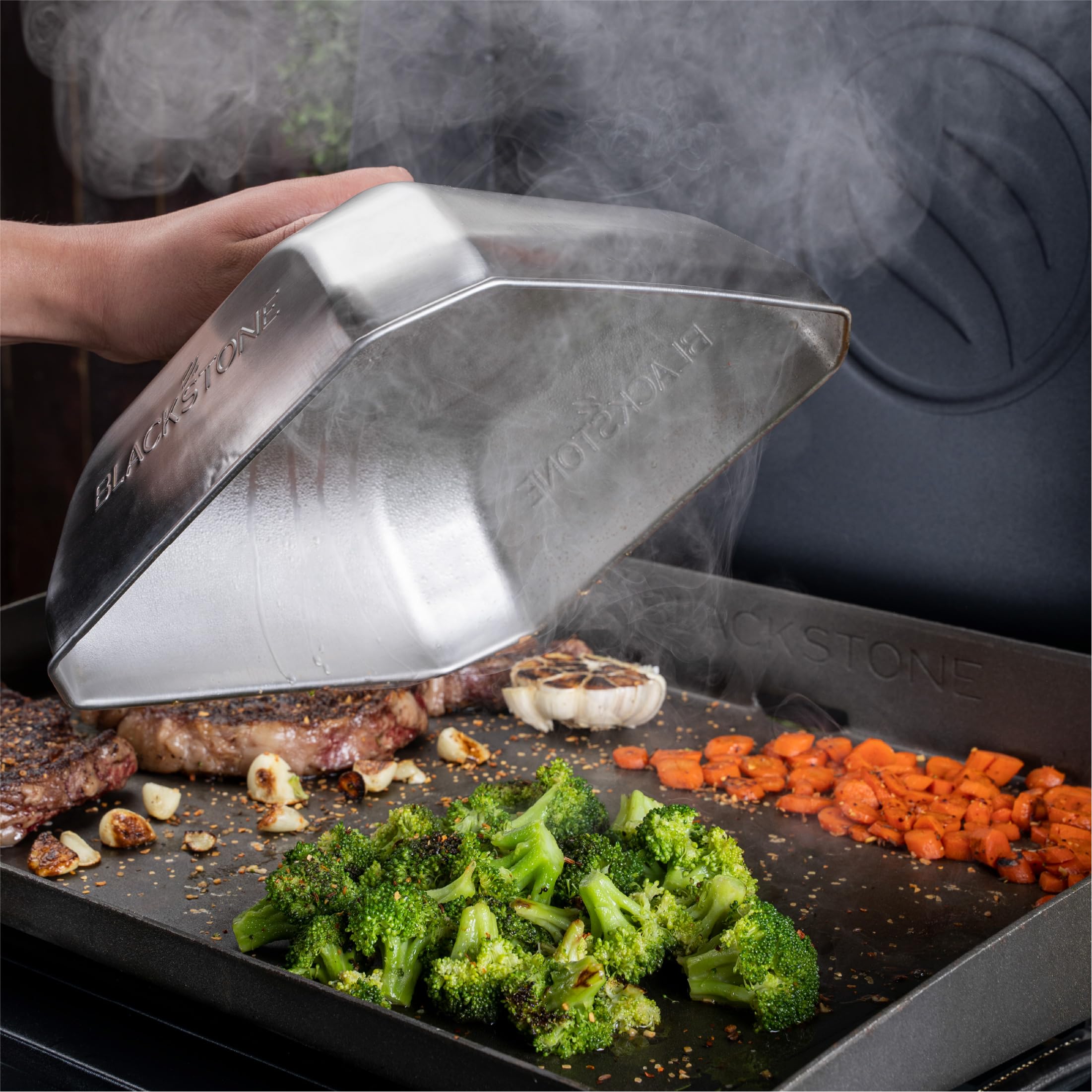 Blackstone cover beside spatula showing 10x10 scale for proper fit