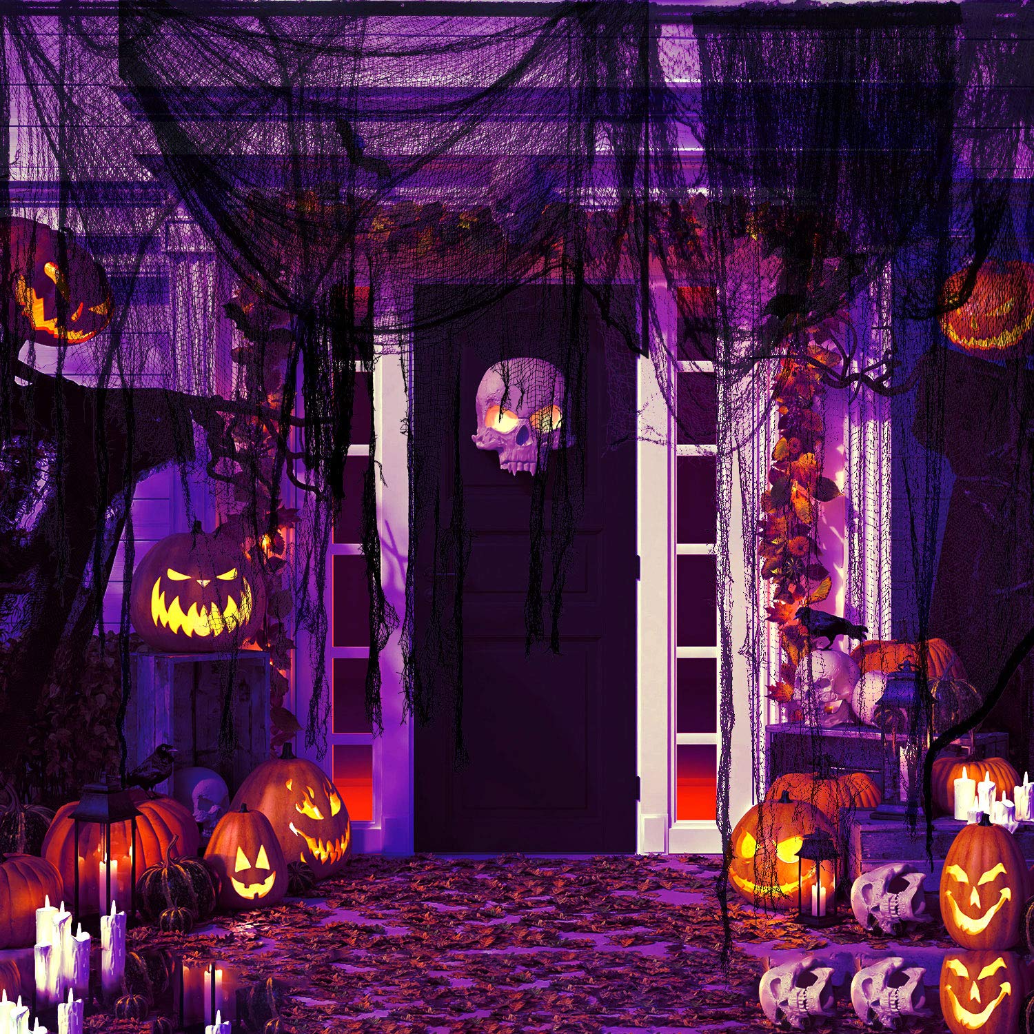 Boao gauze draped over a window to create shadowed Halloween silhouettes