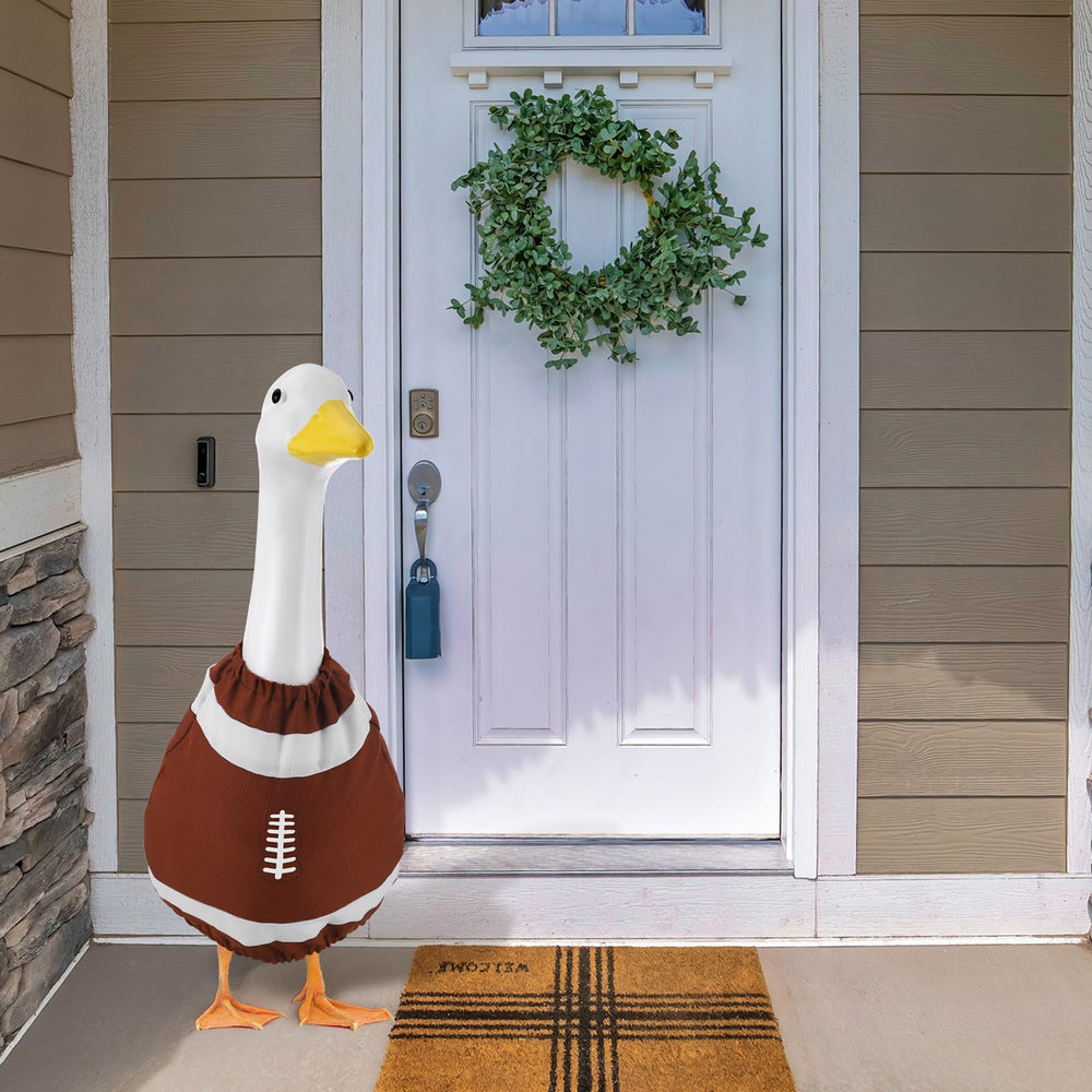 Booson side profile of dressed goose on porch demonstrating festive look