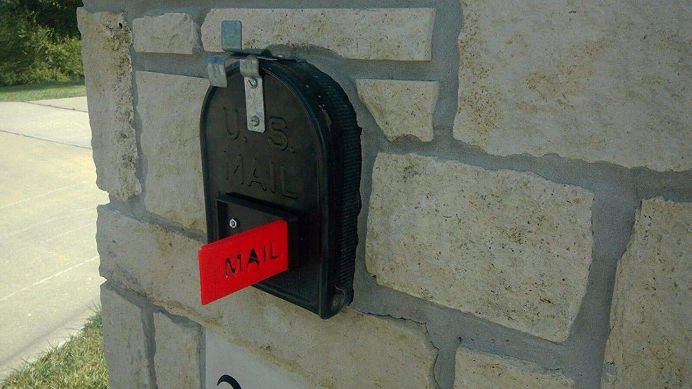 Cartener mailbox flag folded down flush against mailbox front for low-profile look