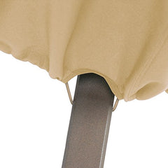 Classic Accessories cover on a patio fire pit in outdoor setting showcasing all-weather protection
