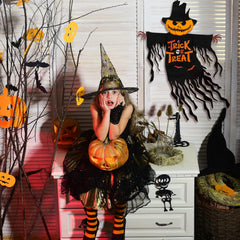 COCHIE flag displayed in yard adding festive Halloween atmosphere to garden