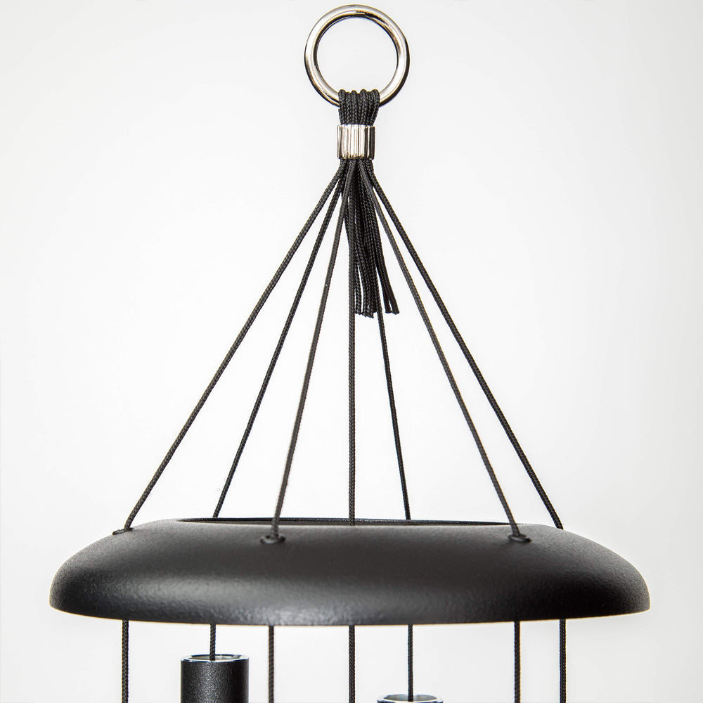 Corinthian Bells beside a chair showing size and scale benefit: ideal mid-size profile