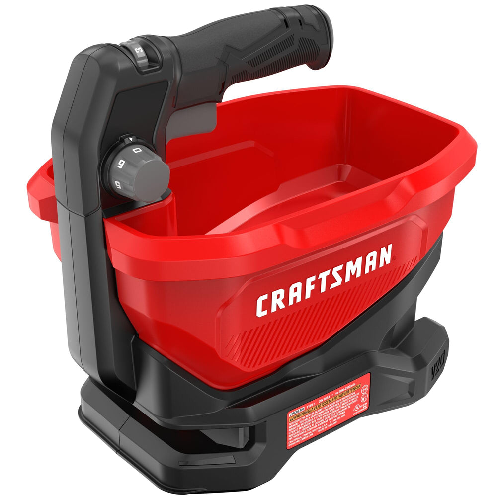 CRAFTSMAN spreader held by user showing handheld scale and ergonomic handling