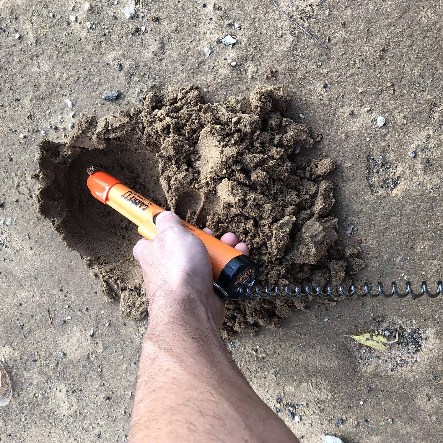 Detector Warehouse pinpointer in use with lanyard attached, keeps Garrett Pro-Pointer AT secure and hands-free