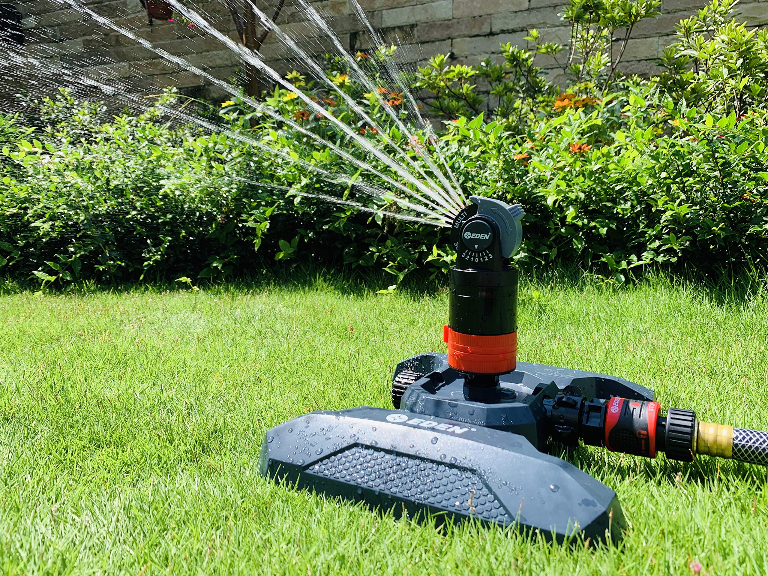 Eden sprinkler in lawn lifestyle scene showing broad area watering
